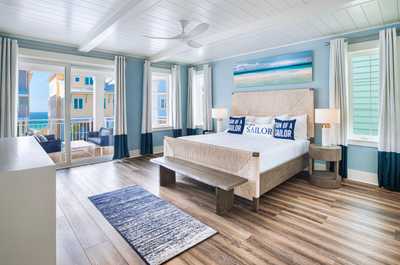 Enjoy the gulf breeze and views from the Primary Bedroom’s private balcony.