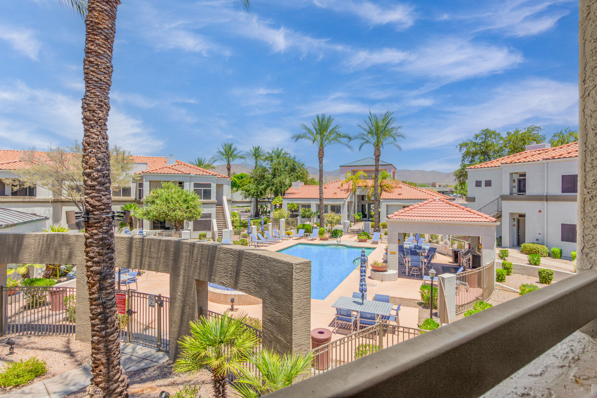 image From the comfort of your balcony, soak in the beauty of the resort pool and mountain views- a truly stunning sight.