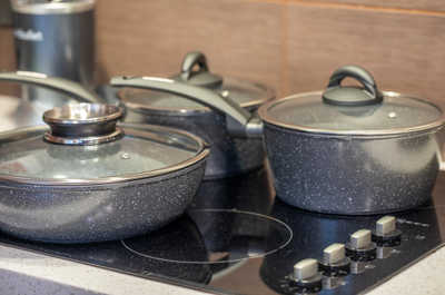 Graphic coated saucepans and pans