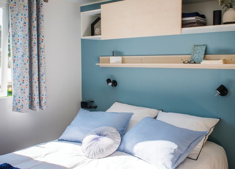 image The inviting master bedroom features soothing colors and modern decor, creating a tranquil retreat after fun-filled beach days.