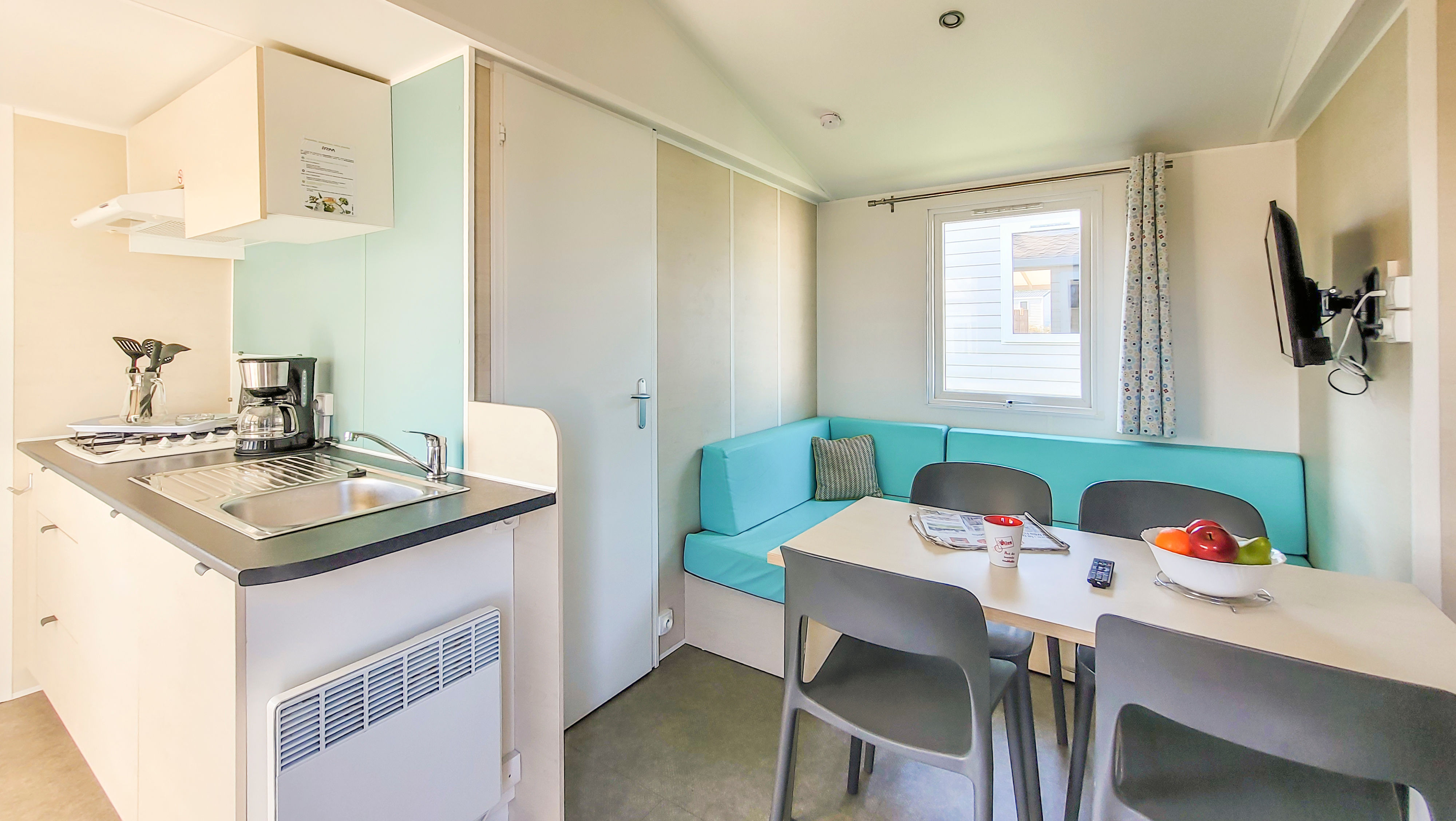 image A bright and functional living area showcasing modern comforts, where families can unwind and create lasting memories.