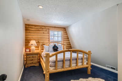 The fourth bedroom features a queen bed.