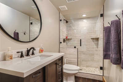 The ensuite bathroom features a shower/bath combo.