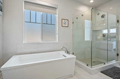 Indulge in luxury with the master suite's ensuite bathroom, complete with a refreshing shower and relaxing tub.