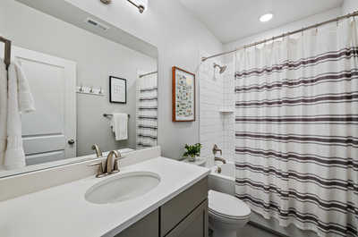 Freshen up in our clean, conveniently located hallway bathroom.