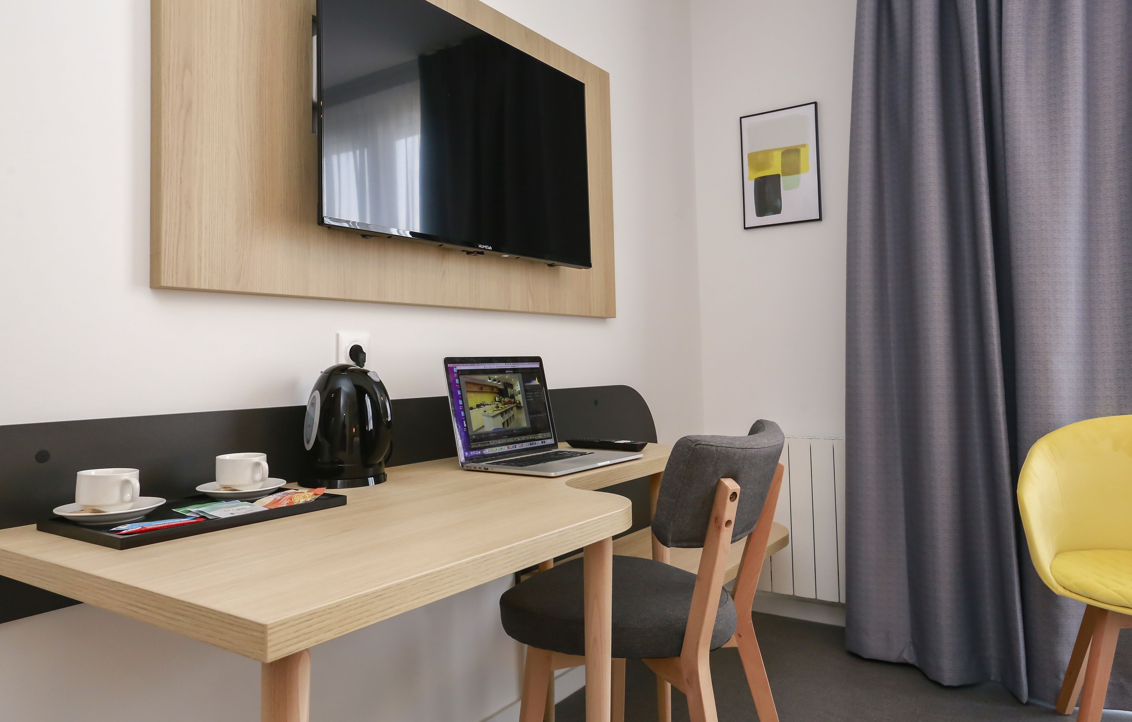 image Stay productive on vacation with our in-suite desk, perfect for any remote work needs.