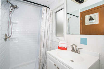 Refresh and rejuvenate in the tranquil bathroom shower after a day of beach fun.