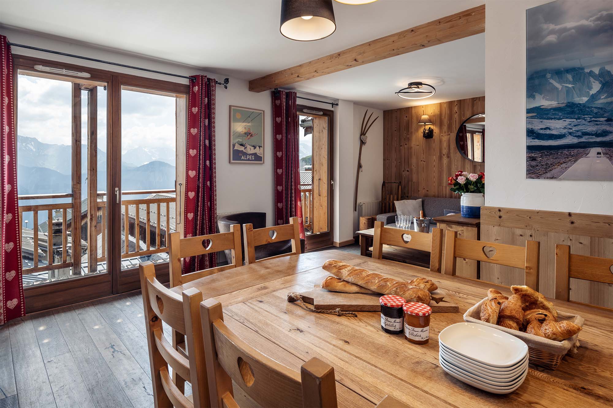 image Dine with a view in the comfortable dining area, featuring rustic wooden furniture and a beautiful landscape.