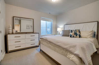 This bedroom located on the ground floor offers a spacious and plus king bed.