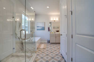 Elevate your relaxation ritual in our elegant ensuite bathroom, boasting a classic bathtub and a refreshing shower