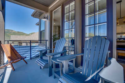 Experience relaxation at its best on our balcony, featuring comfortable Adirondack chairs and a tranquil setting.