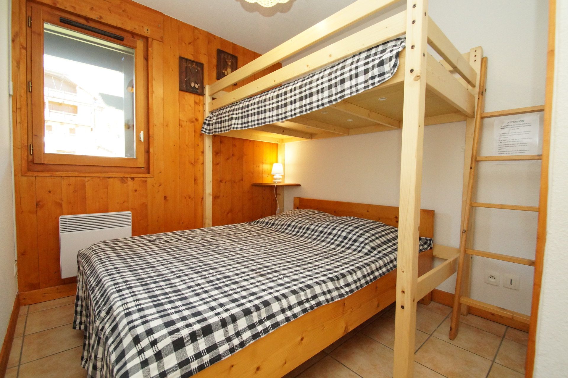 image The second bedroom features a double bed with an additional single bed nestled above on the mezzanine.