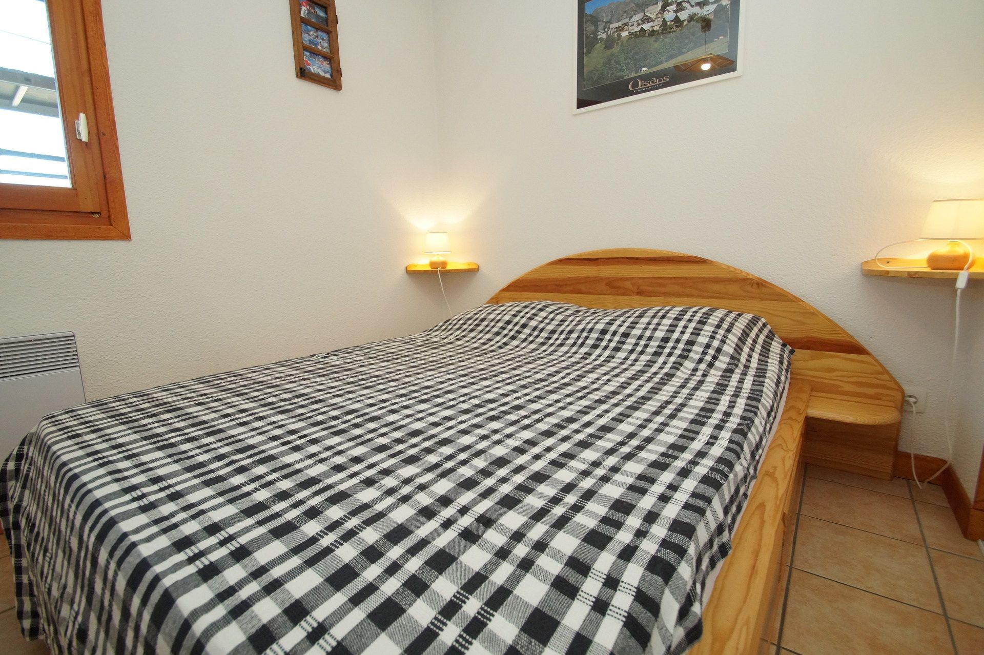 image Cosy double bed with serene mountain ambience.