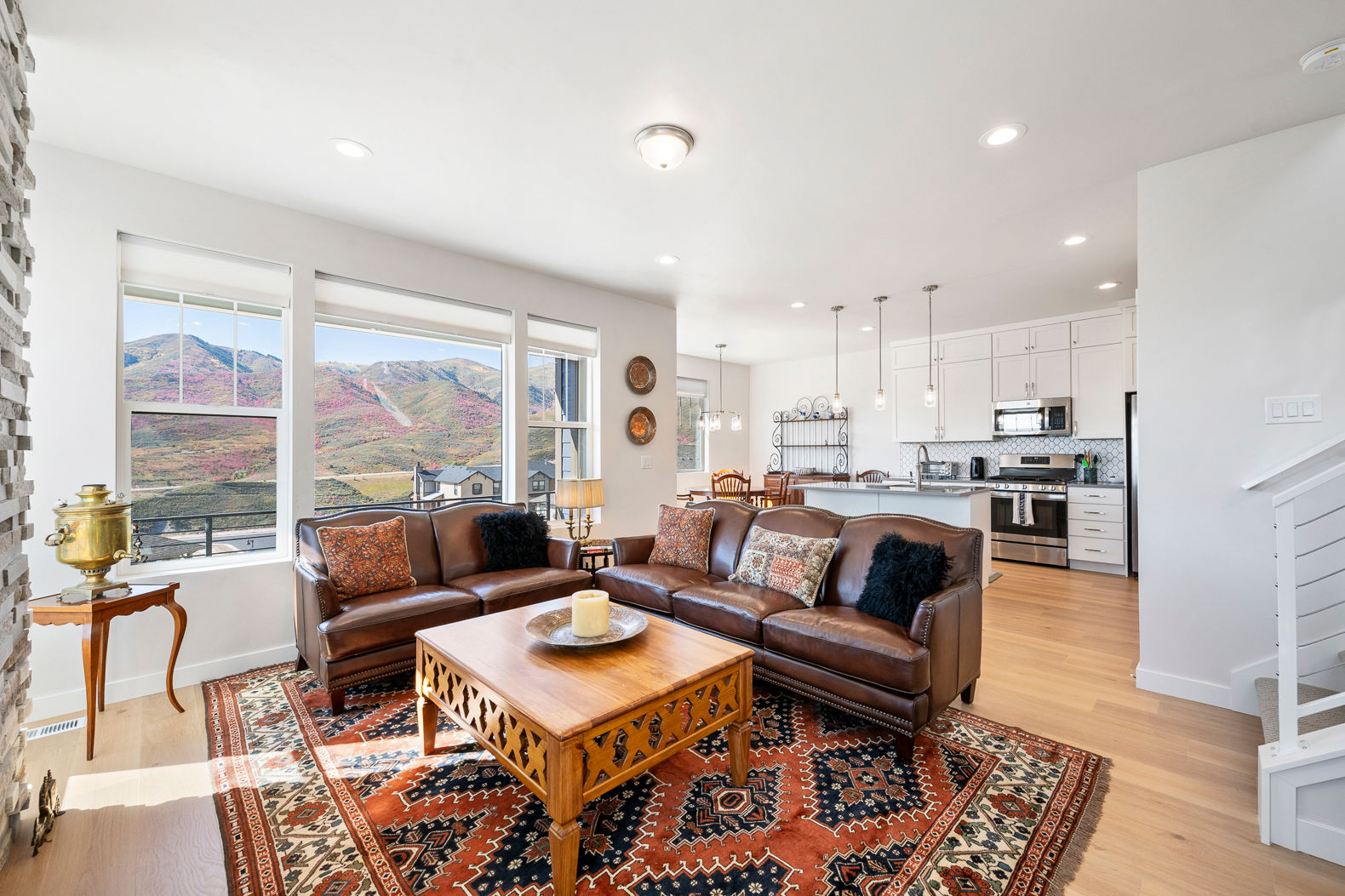 image The spacious living area offers a breathtaking overlook of scenic mountain views through large windows.