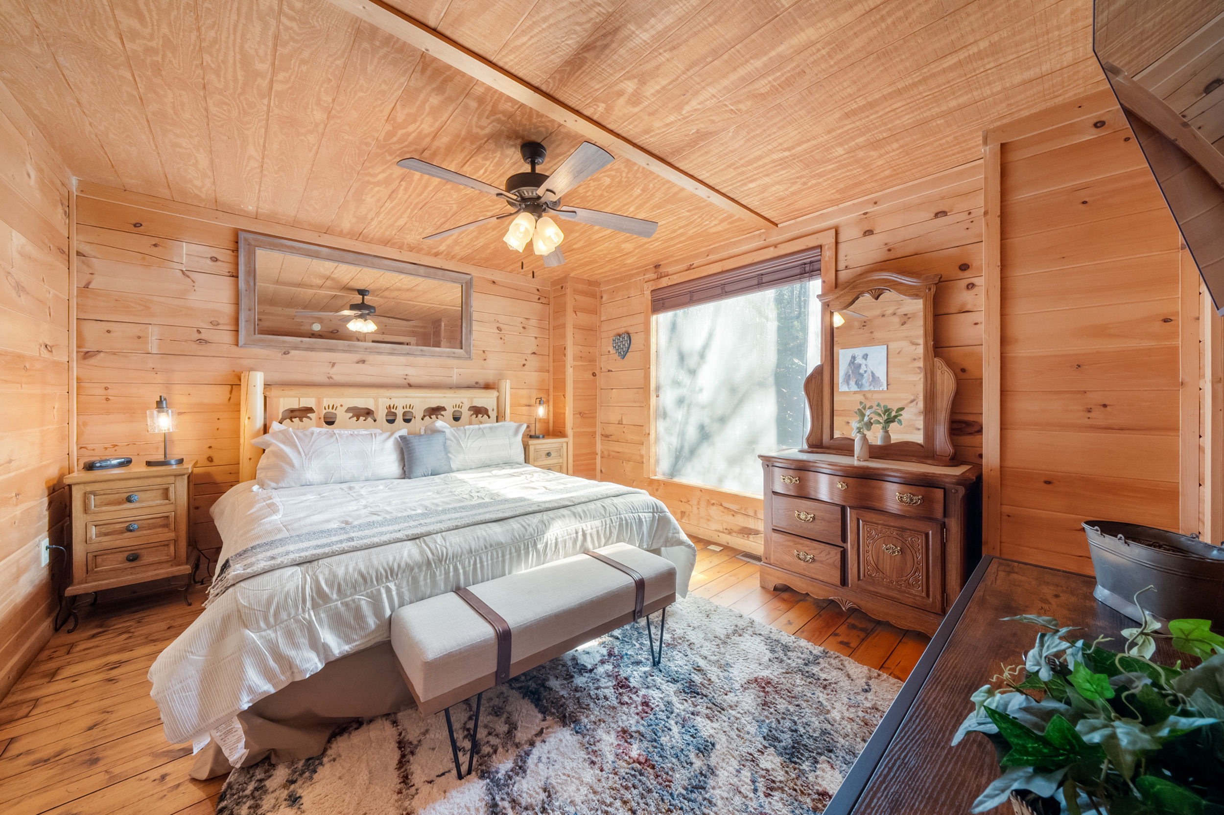 image Dream away in this serene bedroom oasis, surrounded by the comforting embrace of natural wood.