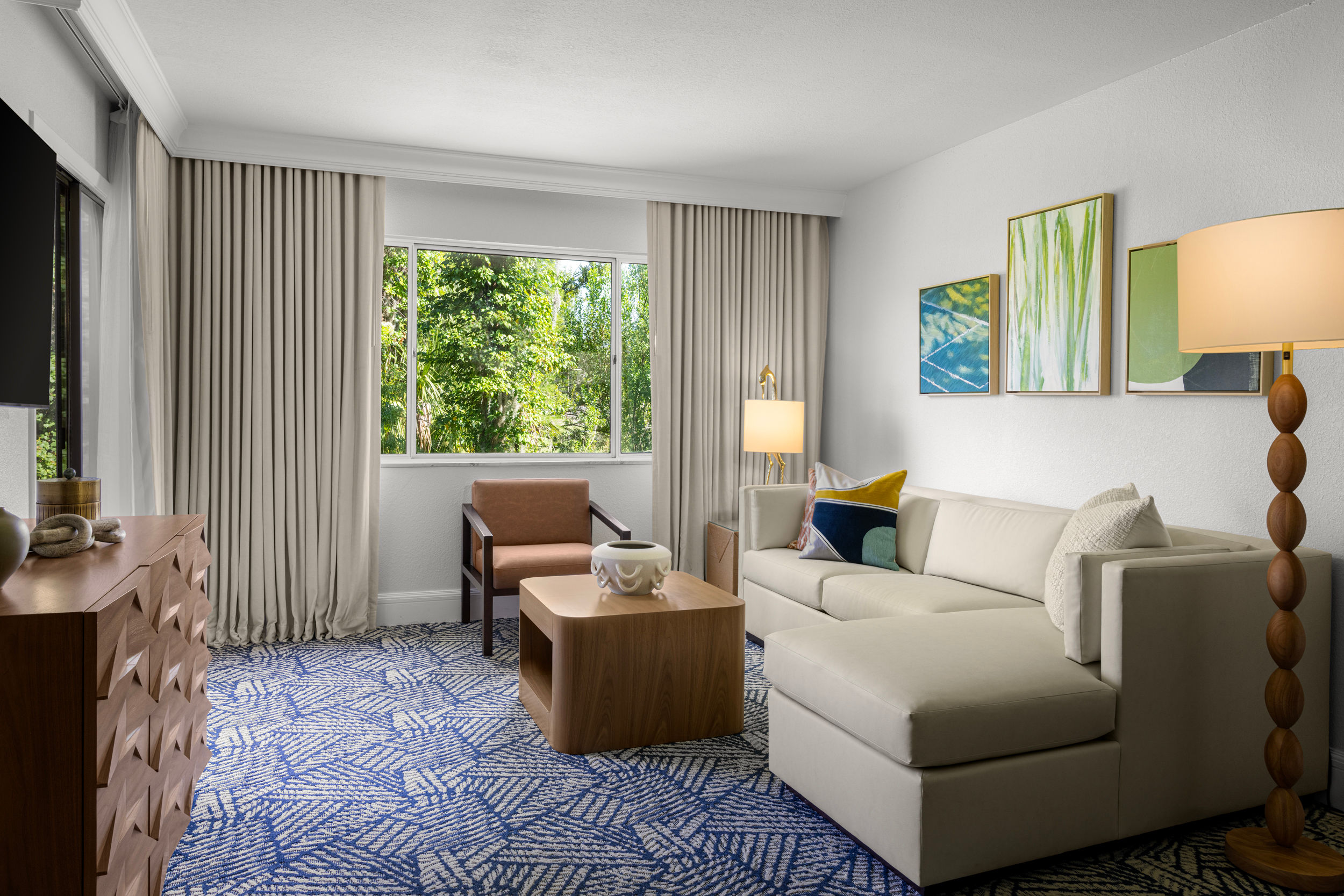 image Settle into a spacious living area where comfort meets modern design.