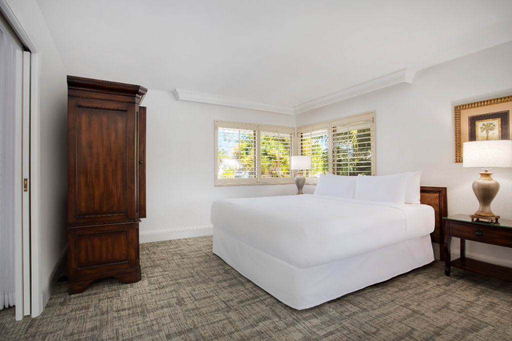 image A cozy bedroom retreat with dark wood tones offering a restful night's sleep.
