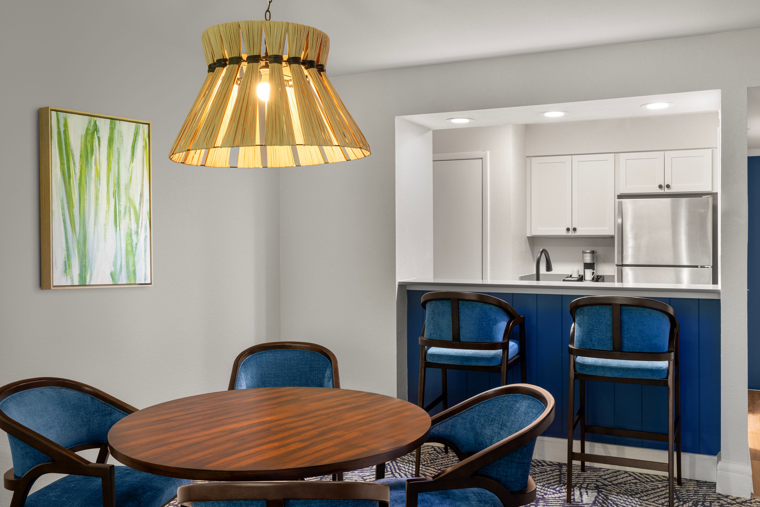 image Share meals in a cozy dining nook paired with the convenience of a kitchenette.