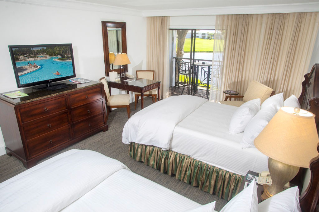 image Luxuriate in the classic charm of our inviting bedroom, boasting a serene ambiance for a restful night.