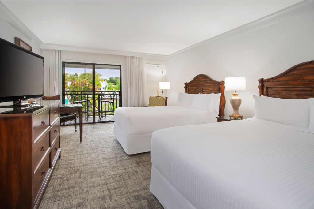 image Spacious and serene, this bedroom offers a plush retreat with a view.