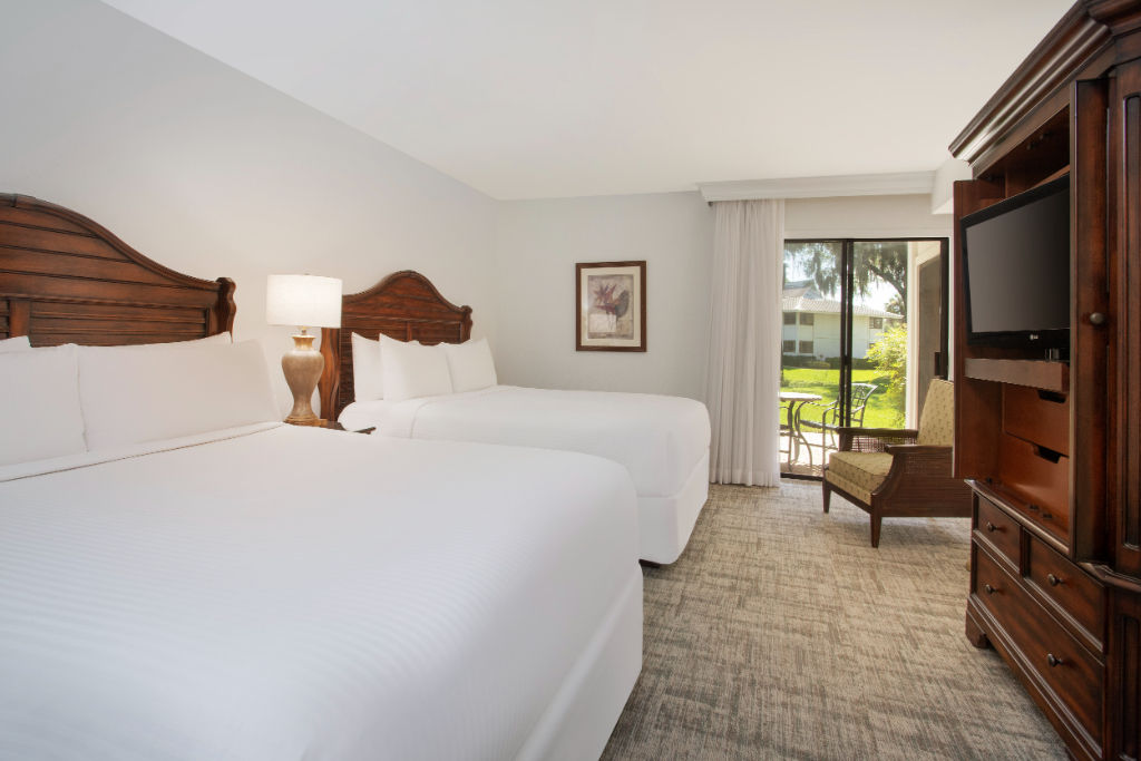 image Find tranquility and rest in this spacious and warmly lit bedroom.