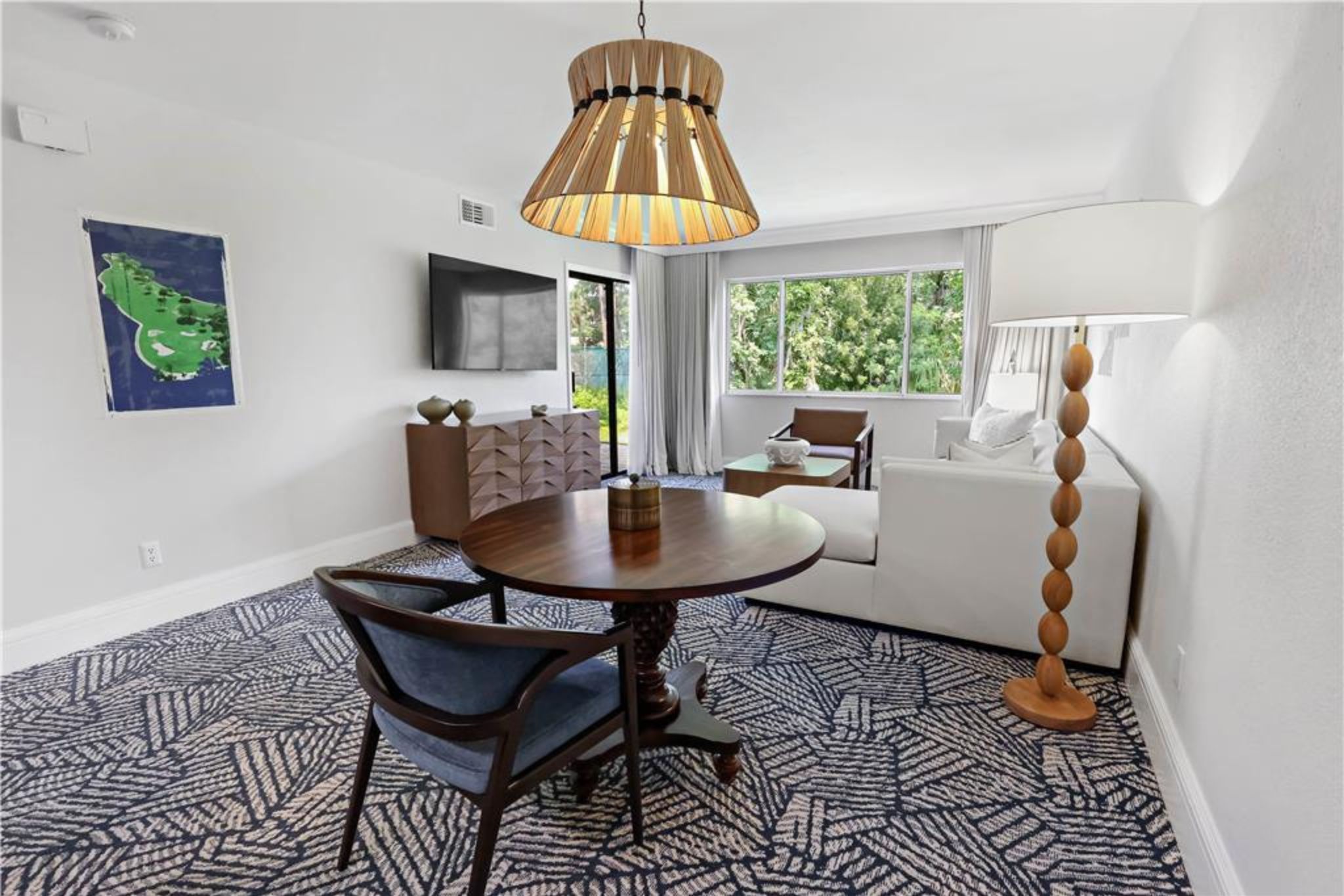 image Share meals and conversation in a bright dining space filled with natural light.