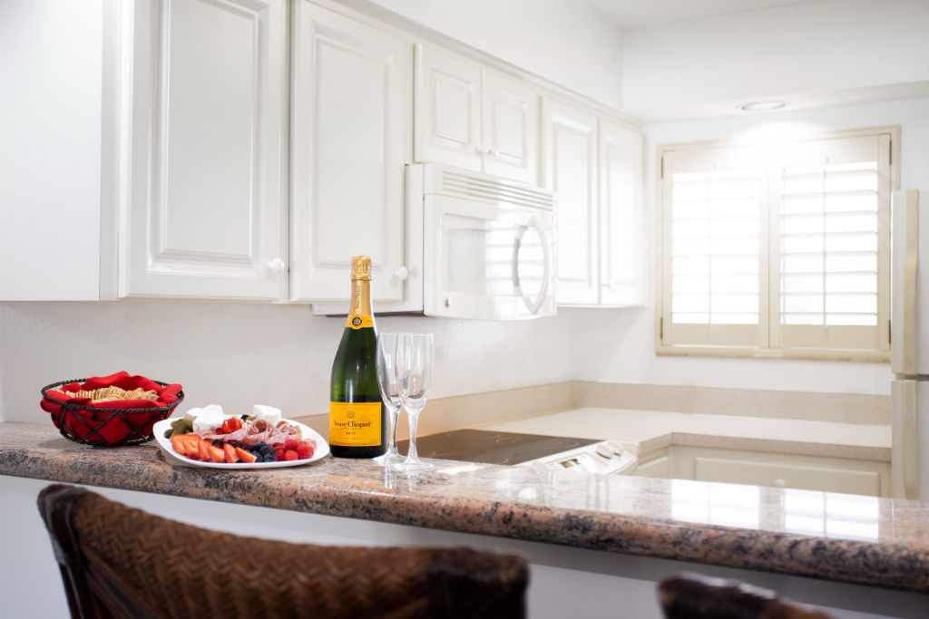 image Savor a special moment with a delightful dining space, complemented by a bottle of bubbly.