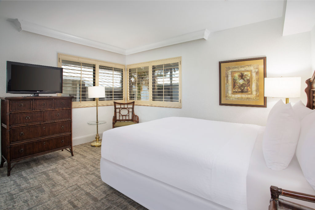 image Lavish in comfort with this expansive and pristine white bedroom.