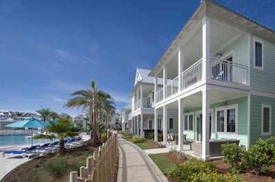 Stroll along sunlit walkways framed by swaying palms and endless ocean skies, steps from the shoreline.