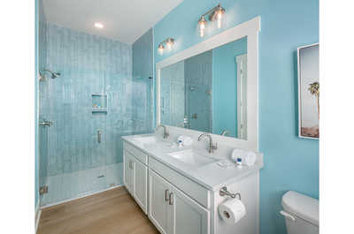 Luxurious bathroom with coastal-inspired tiles, offering a tranquil setting for rejuvenation.