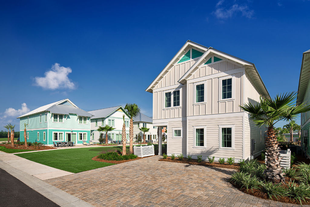 image Picturesque beach house with a welcoming path, offering a blend of luxury and coastal charm.