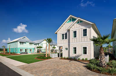 Picturesque beach house with a welcoming path, offering a blend of luxury and coastal charm.