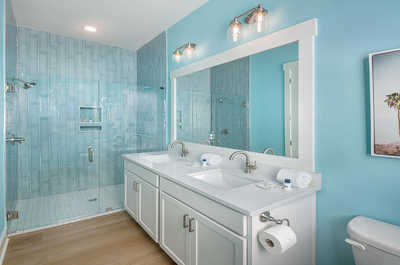 Sophisticated bathroom with elegant turquoise tiles, offering a serene spa experience.