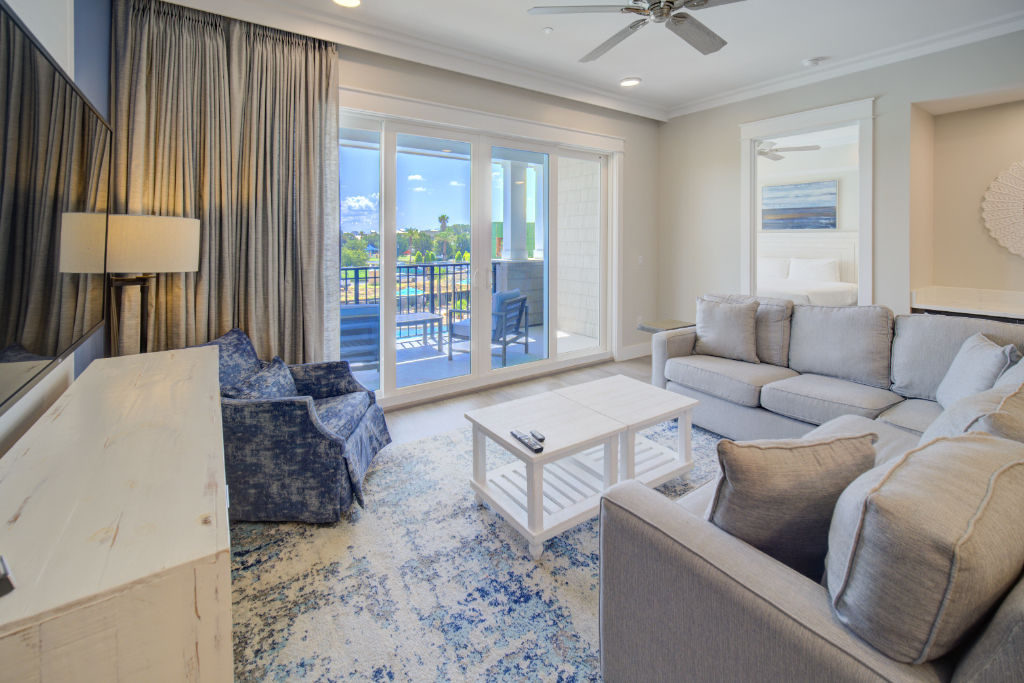 image A chic living space with plush seating and serene ocean views.