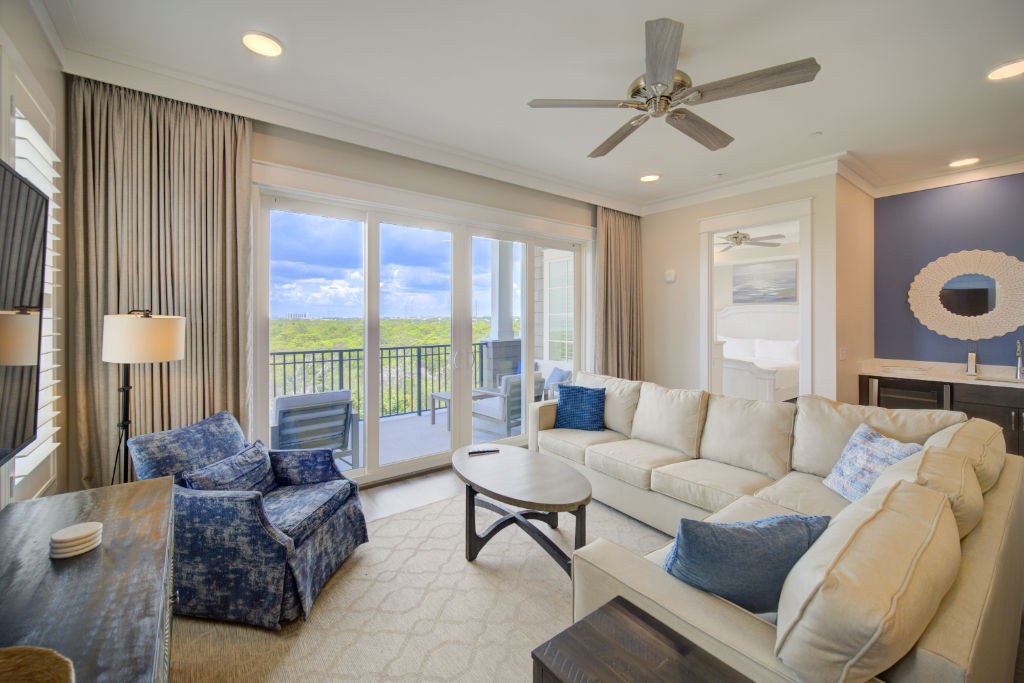 image A spacious and modern living room that flows into the dining area, perfect for entertaining or relaxing.