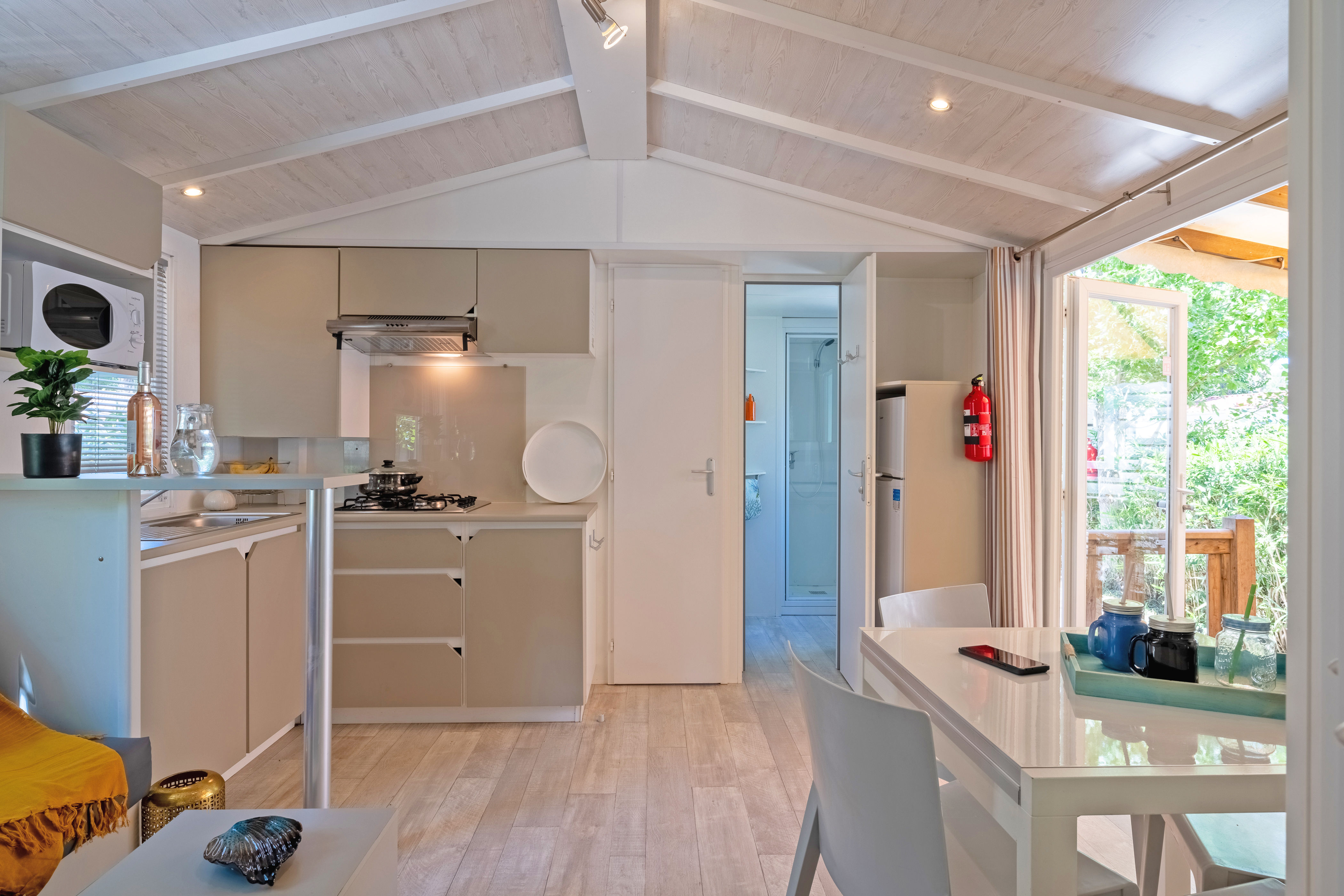 image Bright and airy kitchen and dining area with modern decor, perfect for enjoying meals and gatherings.
