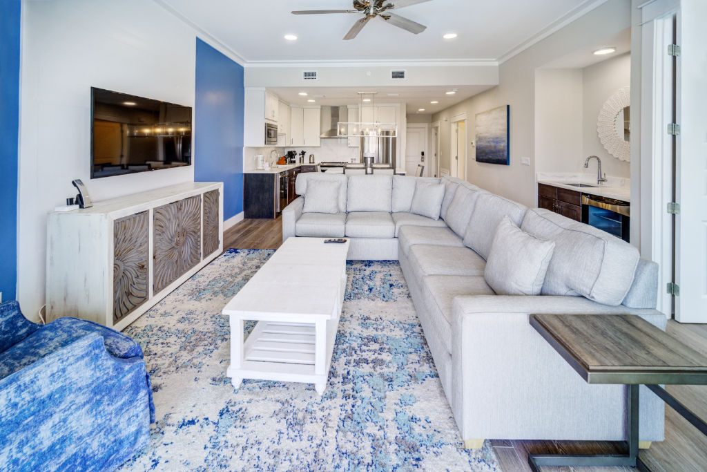 image A spacious living area that extends into the dining space, designed for relaxation and style.