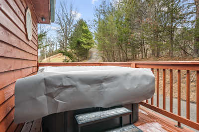 Unwind in the private hot tub nestled on the deck, an ideal spot for relaxation after a day of adventures.