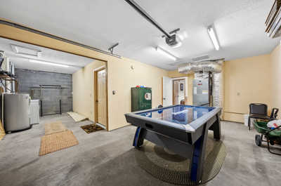 ransformed from a simple garage, this space is now a hub of fun featuring an air hockey table for your entertainment pleasure.