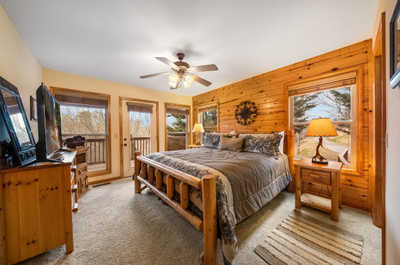 Slumber in style with the spacious king bed in this inviting bedroom, offering peace and tranquility.