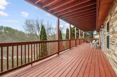 Stretching the length of the home, the deck offers ample room for everyone to find their favorite spot under the sky.