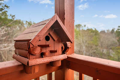 Every detail on the deck adds to the charm of your mountain getaway, from the rustic railings to the crafted wooden supports.