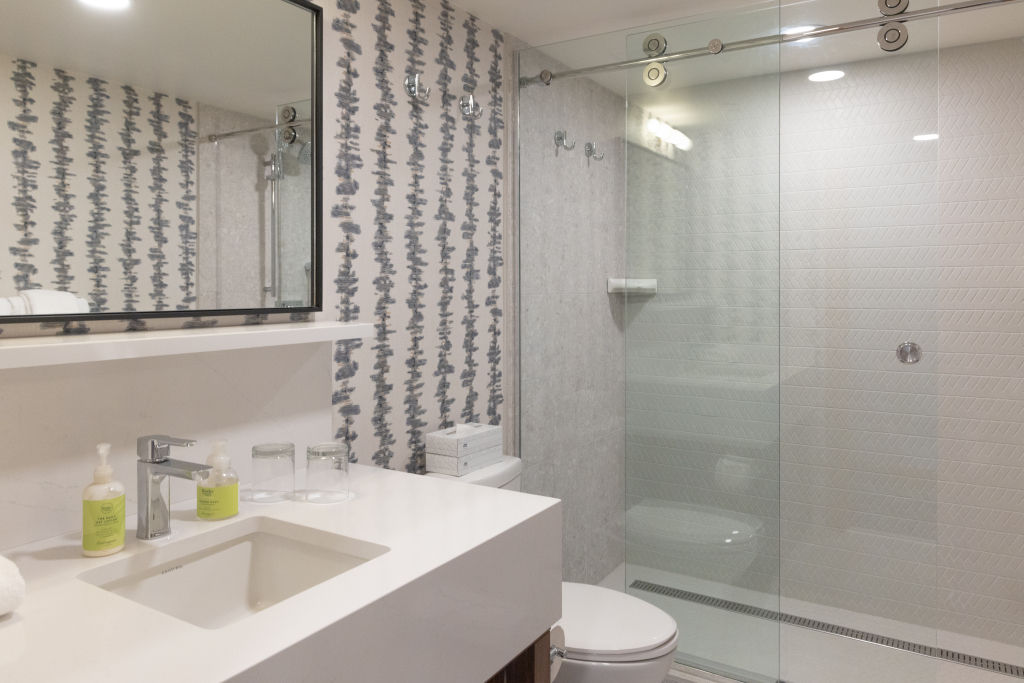 image Bright and modern bathroom with sleek fixtures.