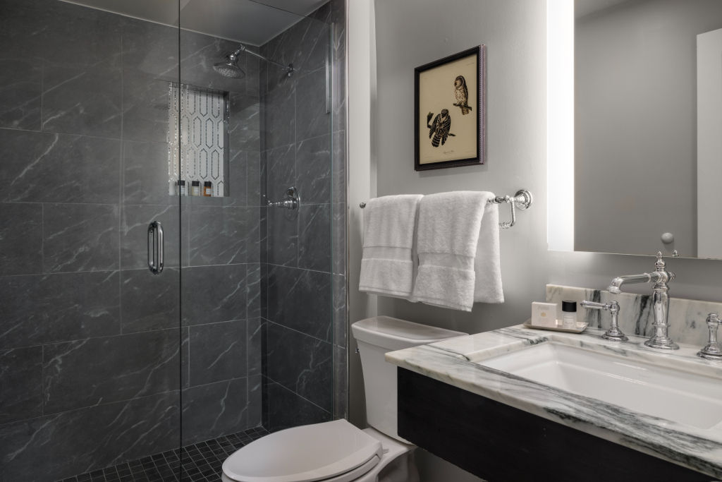 image Sleek bathroom with walk-in shower and contemporary finishes for a luxurious feel.