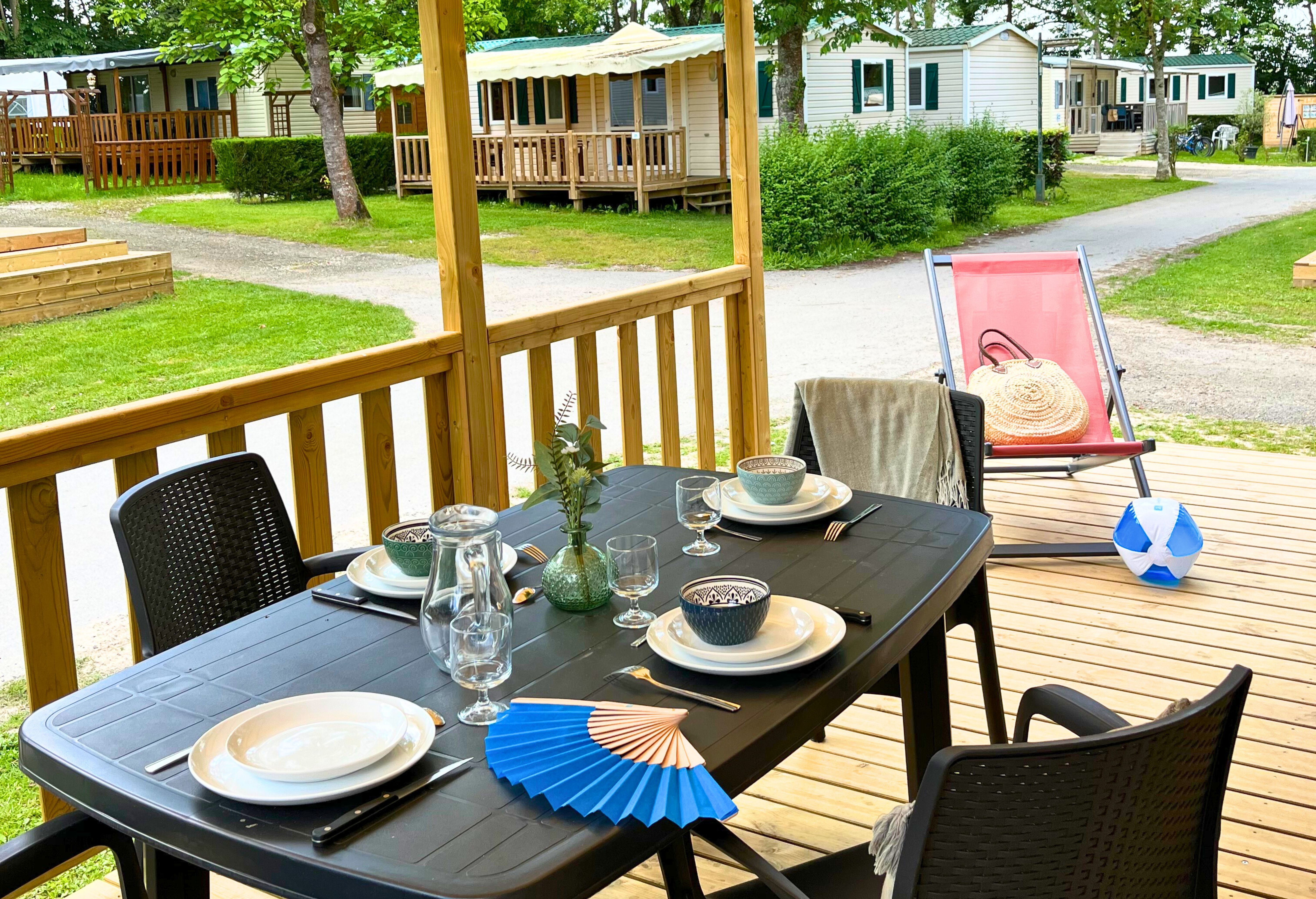image Gather around this inviting outdoor table, where meals are paired with fresh air, good company, and a peaceful view.
