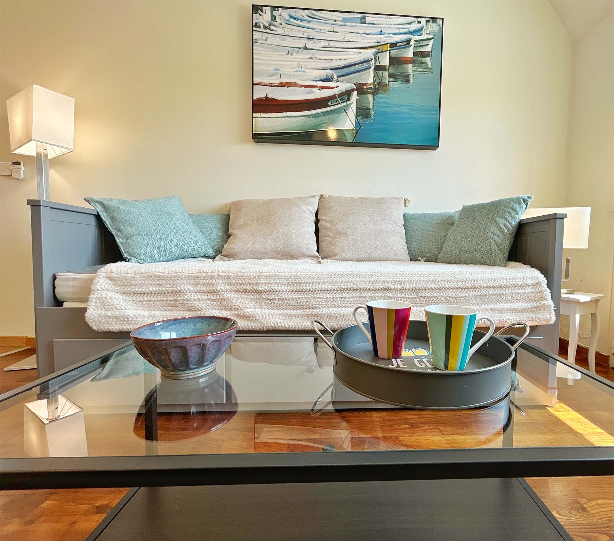 image Cozy living nook featuring a convertible sofa bed, ensuring a restful sleep after a day spent sailing or surfing.