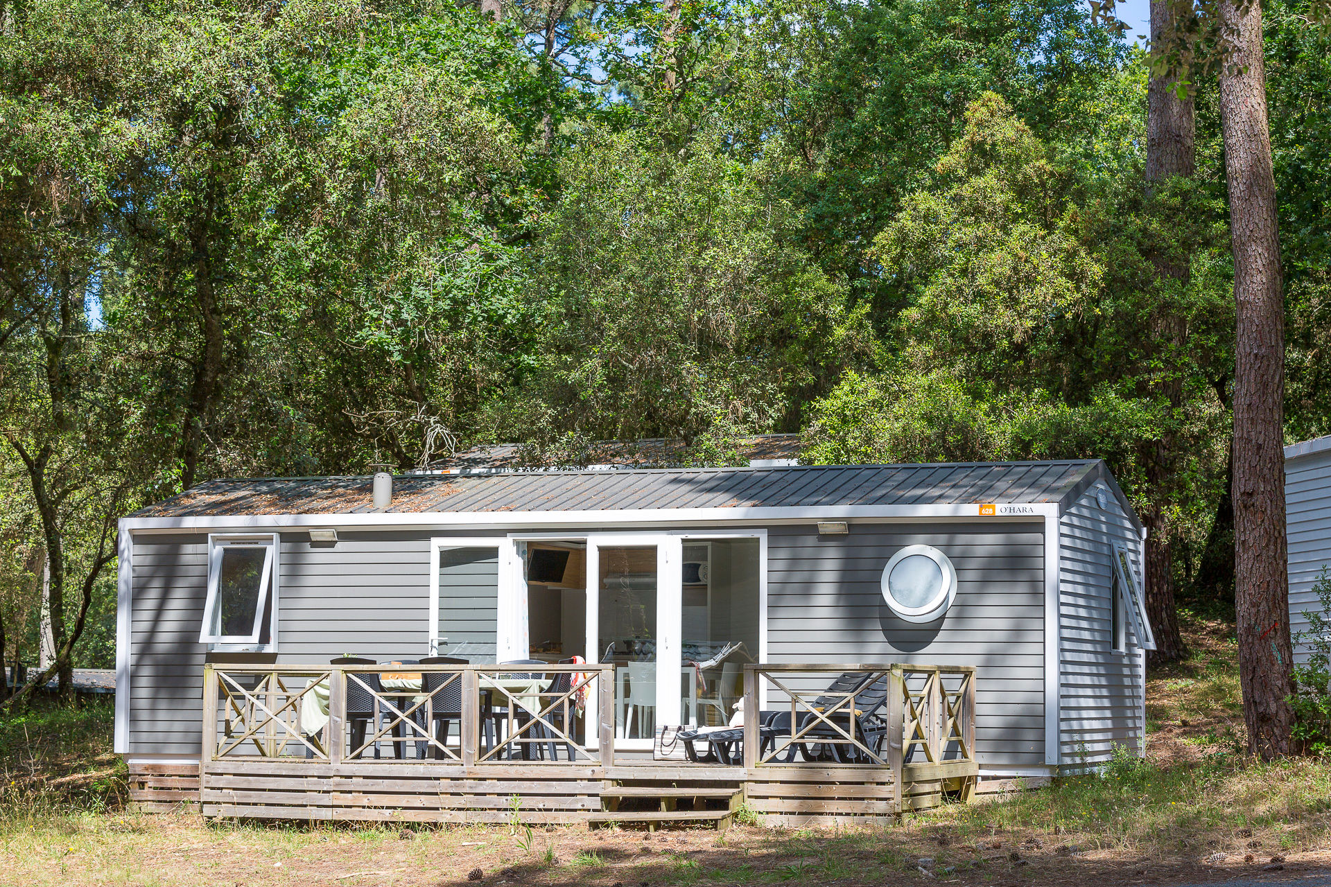 image Nestled among trees, this cozy cabin offers a serene escape with a rustic charm, blending seamlessly with its natural surroundings.