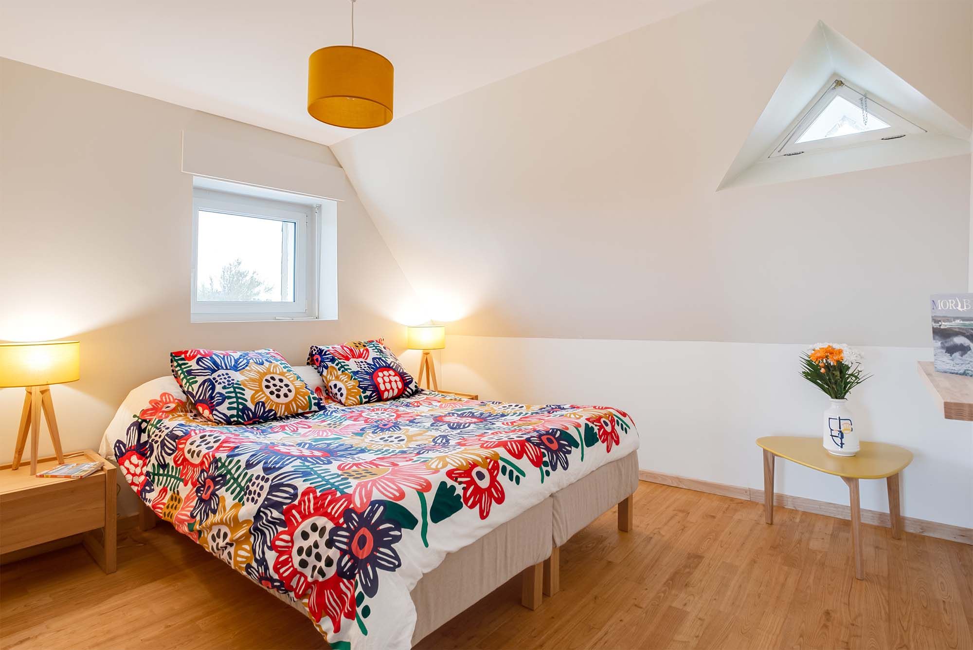 image Restful bedroom with a double bed and plush bedding, offering peaceful sea views to wake up to.
