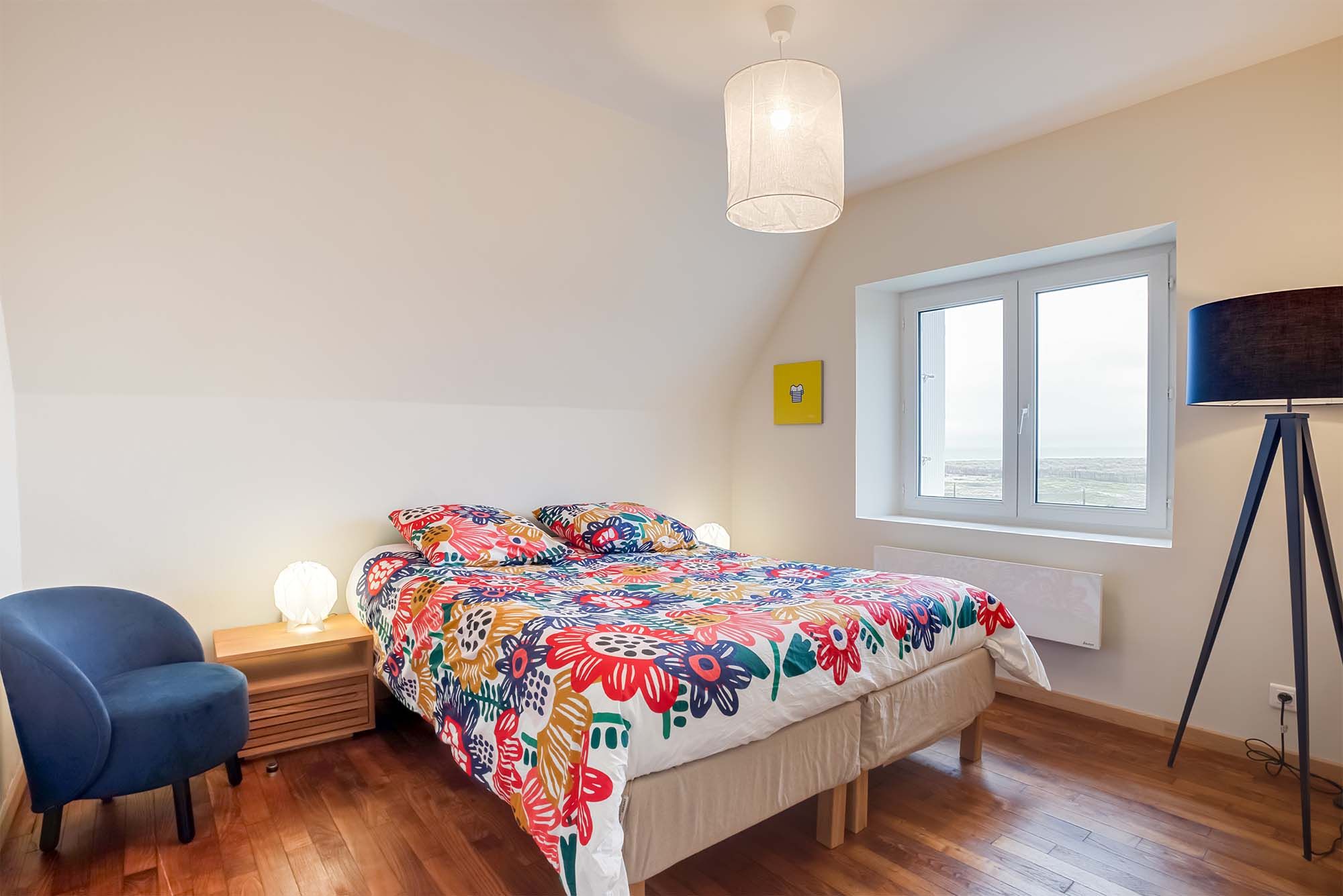 image Second bedroom with ample natural light and a cozy ambience, ensuring a restorative night's sleep.