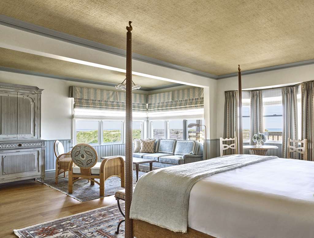 image Wake to golden light and open skies in a tranquil room where coastal elegance meets complete comfort.